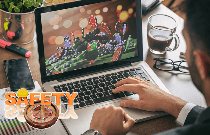 Man Gambling on a Laptop with Safety Logo