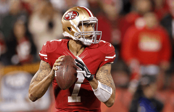 Colin Kapernick About to Throw a Football