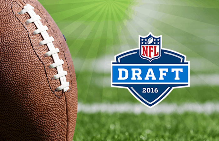 Image of Football in Field with NFL Draft Logo