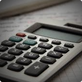 Calculator on pile of paper