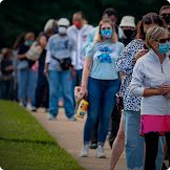 people standing in line to vote