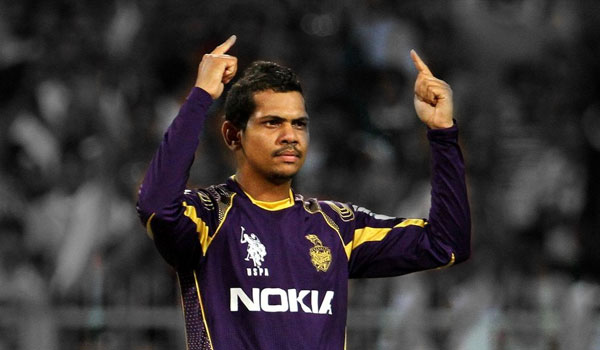 Sunil Narine Playing Cricket and Pointing Up with Both Hands
