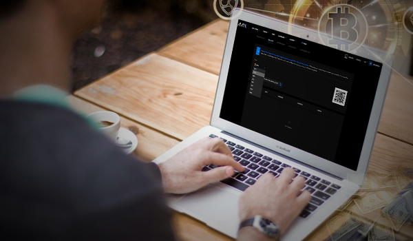 Person on their laptop making a crypto deposit