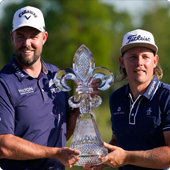 Marc Leishman and Cameron Smith holding 2021 Zurich trophy