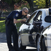 Cop stopping someone in a car