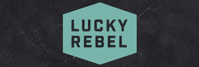 Teal Lucky Rebel logo on dark background