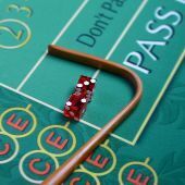 Dice and stick on craps table