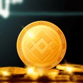 Gold Binance cryptocurrency coin glowing on a dark background with stacked coins and golden light reflections.