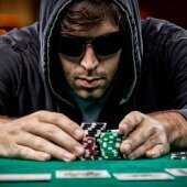 Poker player grabbing chips