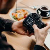 Man looking at his camera 