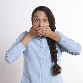 Woman covering her mouth