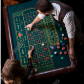 Roulette dealer and woman playing at the table