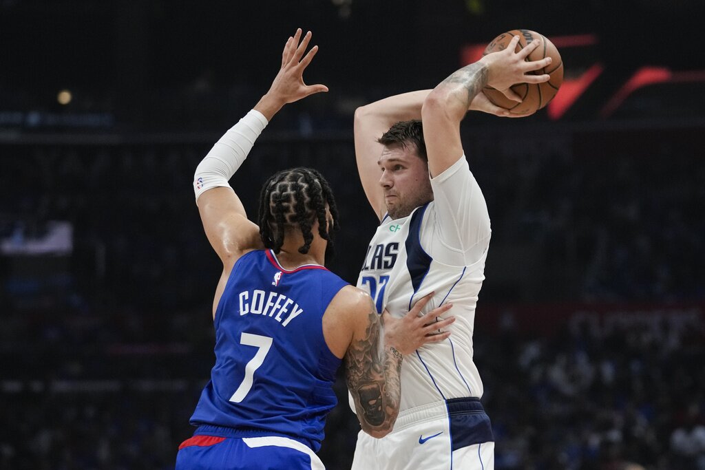 Luka Doncic being guarded by Amir Coffey