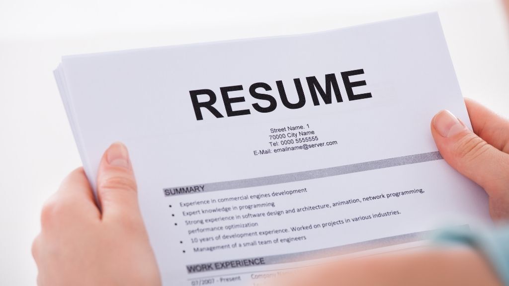 Someone holding a resume