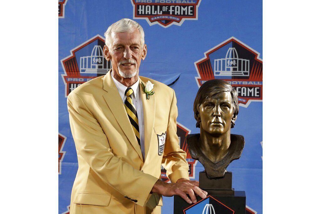 Hall of Fame inductee Ray Guy poses with his bust