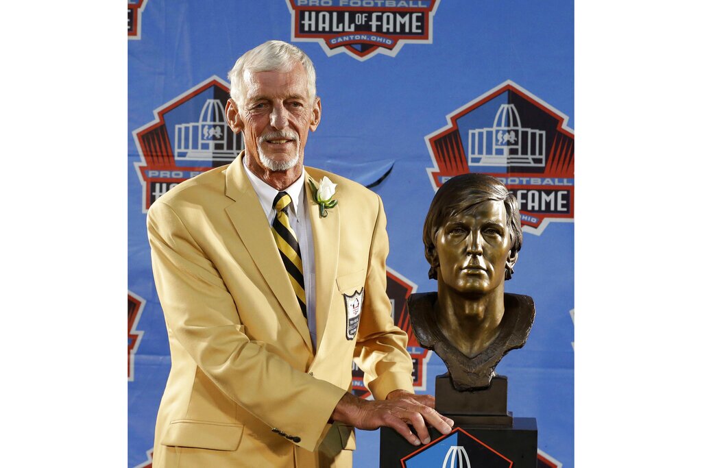 Hall of Fame inductee Ray Guy poses with his bust