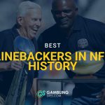 Former New York Giants head coach Bill Parcells, left, holds the Super Bowl XXV trophy while joining former linebacker Lawrence Taylor on stage