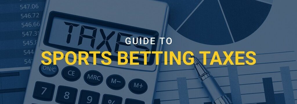 Calculator saying taxes with graphs on paper