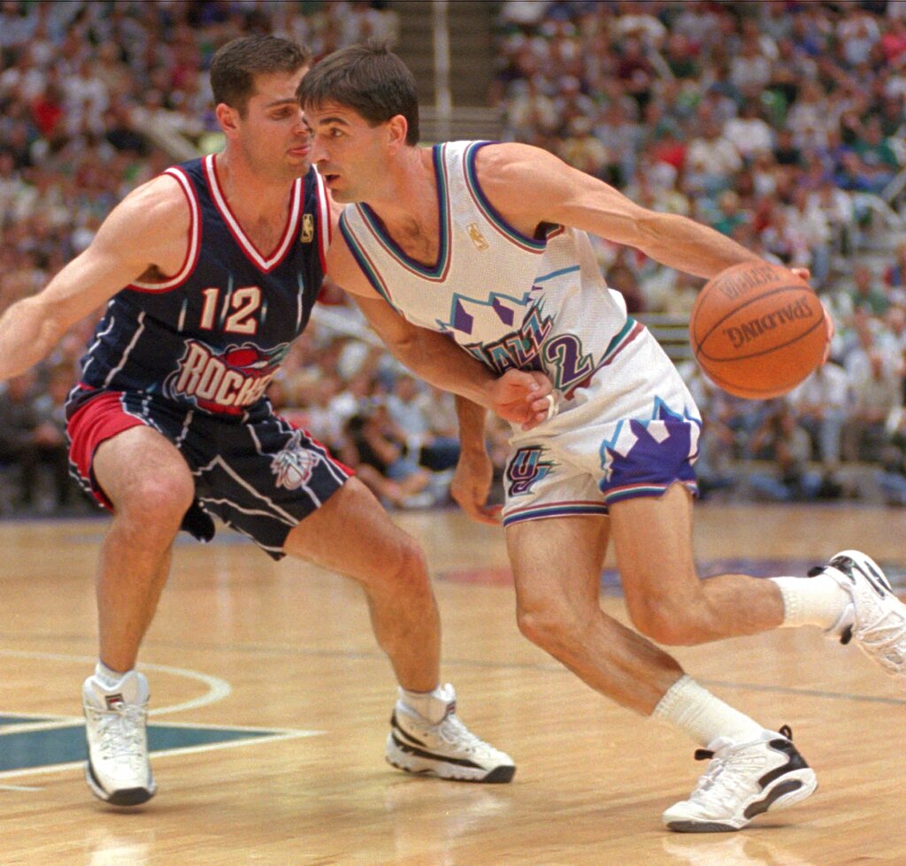 Utah Jazz John Stockton drives against Houston Rockets Matt Maloney