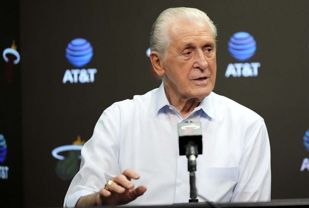 NBA coach Pat Riley in a suit on the sidelines during a game
