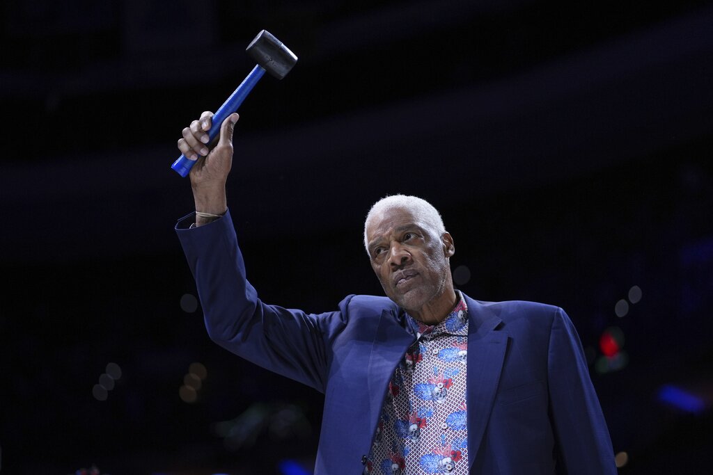 Former Philadelphia 76ers' Julius Erving reacts before an NBA basketball game