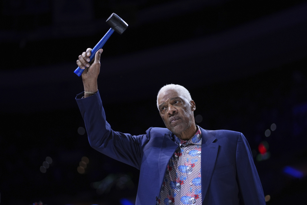 Former Philadelphia 76ers' Julius Erving reacts before an NBA basketball game