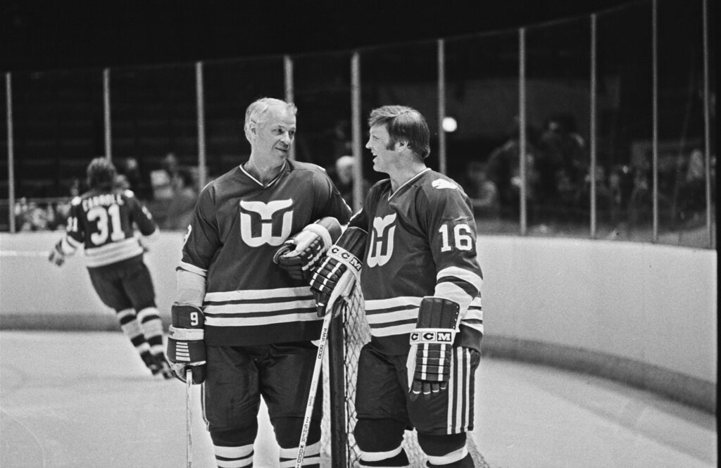 Hartford Whalers' star Gordie Howe, left, and Bobby Hull, right, have a chat