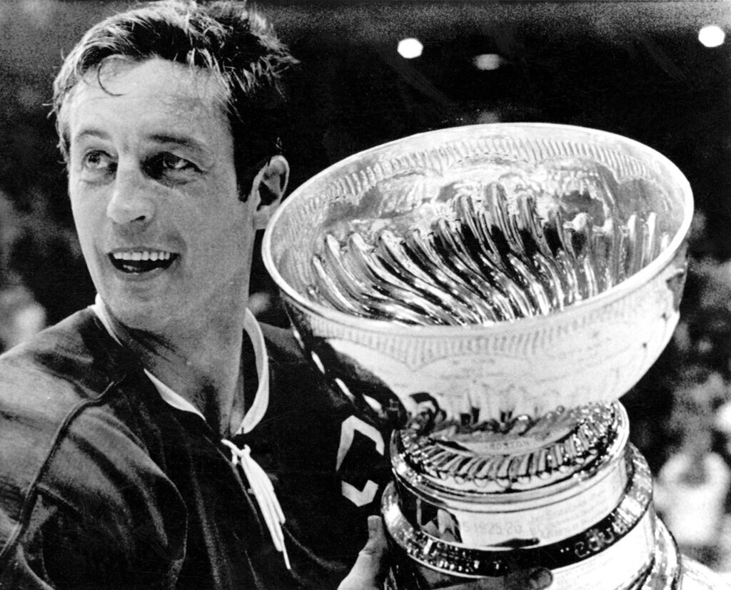 Montreal Canadiens team captain Jean Beliveau holds the Stanley Cup