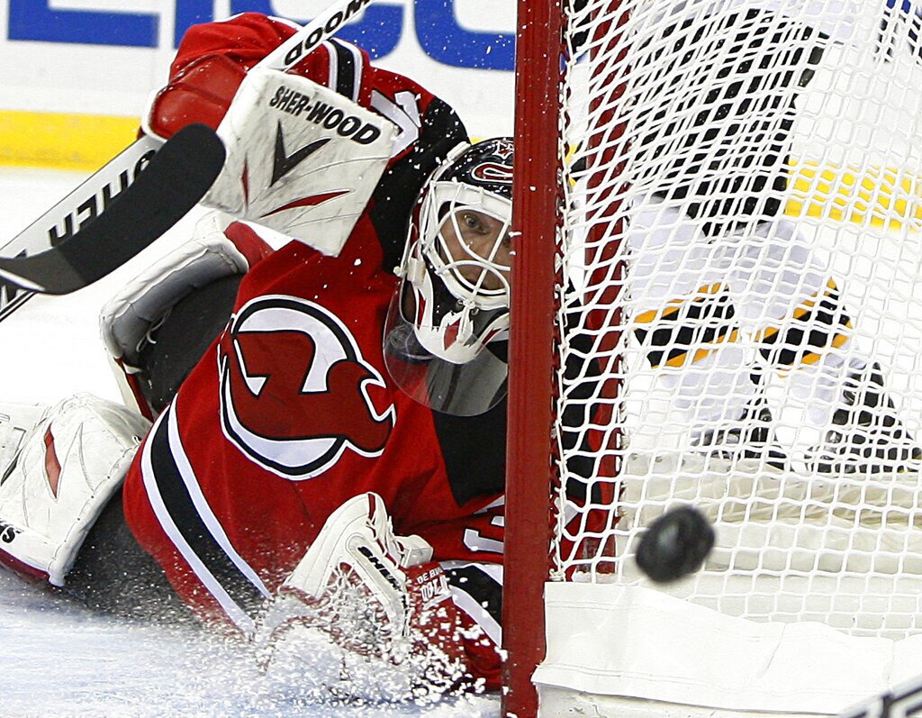 New Jersey Devils' Martin Brodeur blocks a Boston Bruins shot