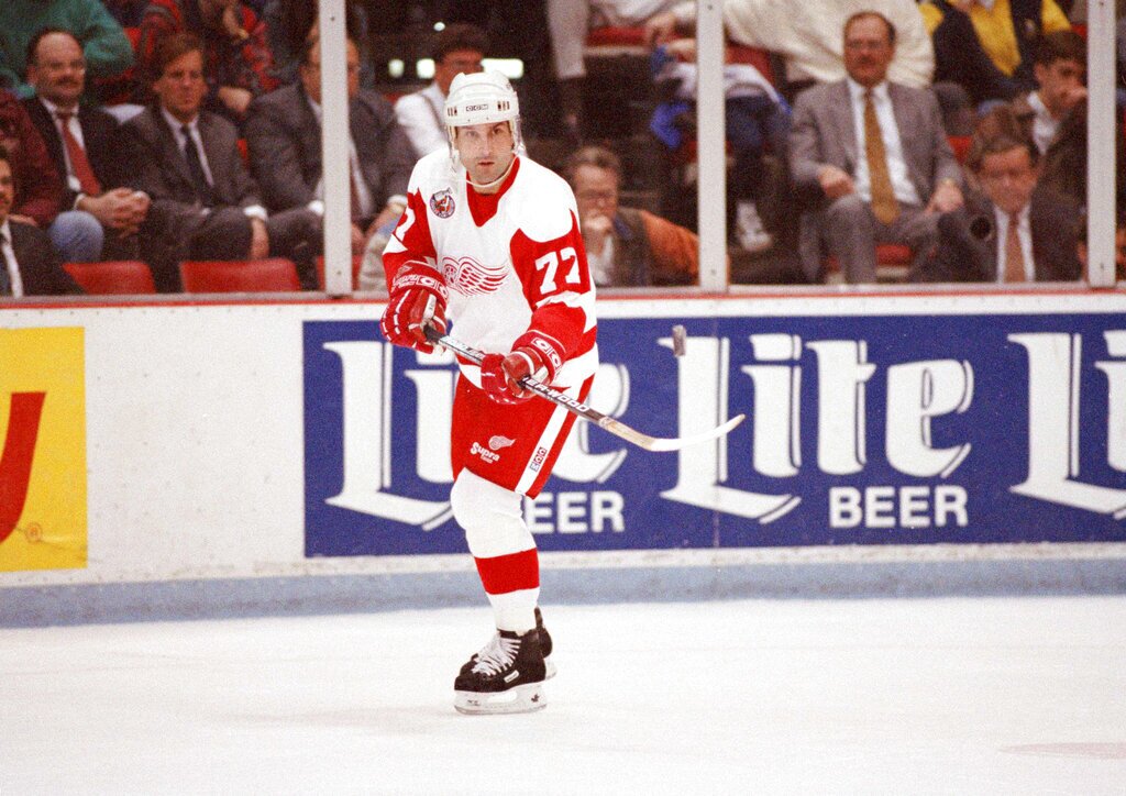 Detroit Red Wings Paul Coffey passes the puck off