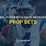 Carolina Panthers player in a white helmet and jersey during a game, with “NFL Super Wild Card Weekend Prop Bets” text overlay and GamblingSites.com branding.