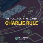 Blackjack table with multiple cards laid out and overlay text reading “Blackjack Five Card Charlie Rule” with GamblingSites.com logo at the bottom.