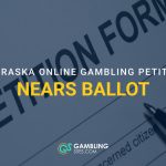 Petition form with a pen and text reading “Nebraska online gambling petition nears ballot.”