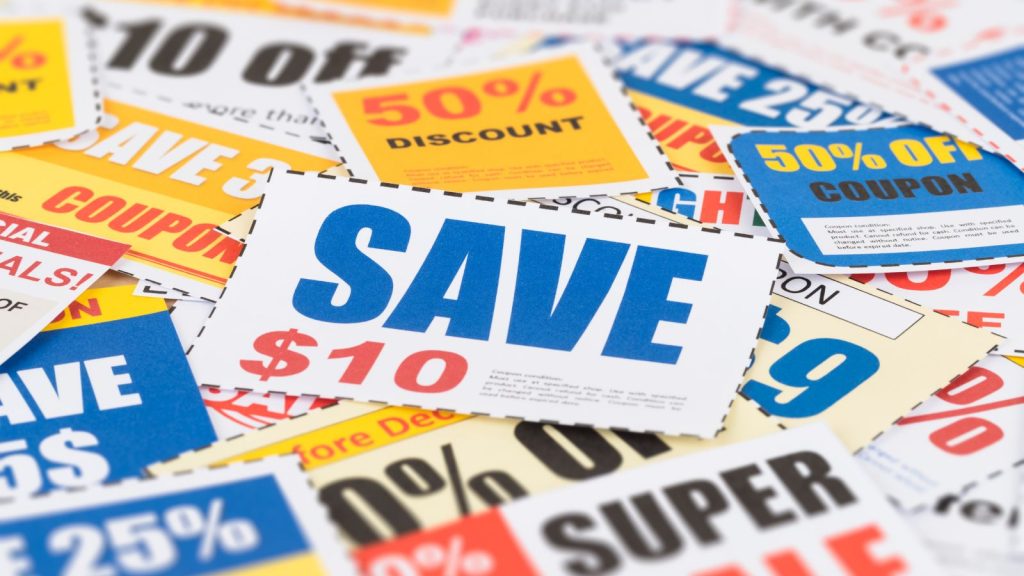 A pile of colourful discount coupons featuring offers such as “Save $10” and “50% off.”