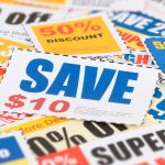 A pile of colourful discount coupons featuring offers such as “Save $10” and “50% off.”