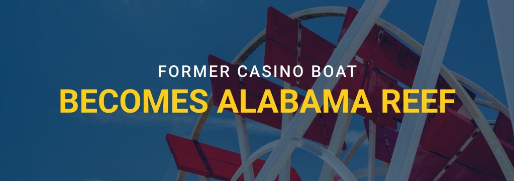 Close-up of a red and white riverboat paddle wheel with overlaid text reading “Former Casino Boat Becomes Alabama Reef” and the GamblingSites.com logo.