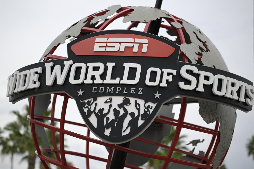 A globe structure is viewed at the entrance to the ESPN Wide World of Sports