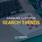 Laptop with playing cards and casino chips featuring the text “Gambling Addiction Search Trends.”