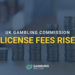 Stacks of coins illustrating rising UK Gambling Commission license fees.