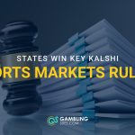 A judge’s gavel beside stacked legal documents, with the headline “States Win Key Kalshi Sports Markets Ruling.”