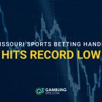 Graphic showing Missouri’s outline over a declining chart with text reading “Missouri sports betting handle hits record low.”