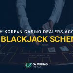 Casino dealer holding cards at a blackjack table with text about South Korean dealers accused in a cheating scheme.