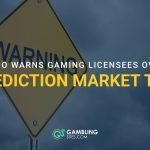 Warning sign with text reading “Ohio Warns Gaming Licensees Over Prediction Market Ties.”